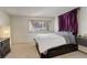 Spacious bedroom with plush carpet and a window at 10395 Red Mountain E, Littleton, CO 80127
