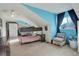 Upstairs bedroom with bunk bed, dresser, and window at 10395 Red Mountain E, Littleton, CO 80127