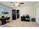 Bedroom with a desk and built-in shelving and access to another room at 10395 Red Mountain E, Littleton, CO 80127