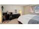 Bedroom with a built-in dresser and an adjacent desk area at 10395 Red Mountain E, Littleton, CO 80127