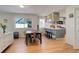 Open concept dining room with hardwood floors and view of kitchen at 10395 Red Mountain E, Littleton, CO 80127