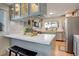 Updated kitchen with light blue cabinets, stainless steel appliances and breakfast bar at 10395 Red Mountain E, Littleton, CO 80127