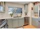 Updated kitchen with light blue cabinets and stainless steel appliances at 10395 Red Mountain E, Littleton, CO 80127