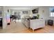 Spacious living room with fireplace, large sectional sofa and piano at 10395 Red Mountain E, Littleton, CO 80127