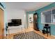 Home office features built-in shelving and a view into the kitchen at 10395 Red Mountain E, Littleton, CO 80127