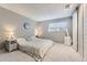 Cozy bedroom with a comfortable bed, neutral tones, and a barn door accent at 4068 S Atchison Way # 101, Aurora, CO 80014