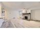 Bright living room with hardwood flooring, stone fireplace, natural light, and modern accents at 4068 S Atchison Way # 101, Aurora, CO 80014