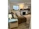Inviting living room with hardwood flooring, natural light, modern sectional, and rustic fireplace at 4068 S Atchison Way # 101, Aurora, CO 80014