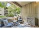 Relaxing outdoor patio with seating, decorative pillows, and views of the surrounding landscape at 4068 S Atchison Way # 101, Aurora, CO 80014