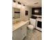 Bathroom and laundry featuring modern fixtures and tile at 14396 E Temple Pl # A, Aurora, CO 80015