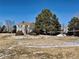 Community volleyball court, common green space and trees at 14396 E Temple Pl # A, Aurora, CO 80015