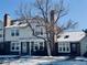 Home featuring a large tree, light siding, and brick at 14396 E Temple Pl # A, Aurora, CO 80015