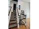 View of the staircase with white railings and carpeted steps at 14396 E Temple Pl # A, Aurora, CO 80015