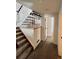 Carpeted staircase with white and dark wood trim at 14396 E Temple Pl # A, Aurora, CO 80015