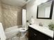 Updated bathroom featuring modern fixtures, tiled shower, and stylish vanity at 2325 S Linden Ct # 211, Denver, CO 80222