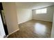 Spacious bedroom with hardwood floors, offering a flexible layout for personalization at 2325 S Linden Ct # 211, Denver, CO 80222