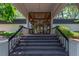 Welcoming entryway showcases a grand staircase and glass doors, creating an inviting atmosphere at 2325 S Linden Ct # 211, Denver, CO 80222