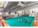 Recreational game room offers a billiards table, seating and access to lobby, ideal for leisure activities at 2325 S Linden Ct # 211, Denver, CO 80222