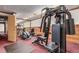 Home gym featuring an array of equipment including a universal weight machine and elliptical trainer at 2325 S Linden Ct # 211, Denver, CO 80222