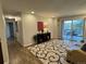 Inviting living room with hardwood floors and access to the outdoor patio for seamless indoor-outdoor living at 2325 S Linden Ct # 211, Denver, CO 80222