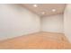 The home's racquetball court features a durable wood floor, perfect for recreational activities at 2325 S Linden Ct # 211, Denver, CO 80222