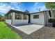 Home's exterior showcasing a patio and grassy yard at 5576 E Lehigh Ave, Denver, CO 80237