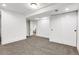 Finished basement with carpet, doors, and access to other rooms at 5576 E Lehigh Ave, Denver, CO 80237