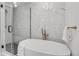 Spa-like bathroom featuring a freestanding soaking tub and walk-in shower at 5576 E Lehigh Ave, Denver, CO 80237