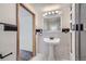 Updated bathroom with pedestal sink and a shower at 483 Tonn Vly, Evergreen, CO 80439