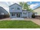 Spacious backyard featuring a well-maintained lawn and new patio space at 5068 E Crestone Ave, Castle Rock, CO 80104