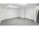 Finished basement with neutral carpet and staircase at 5068 E Crestone Ave, Castle Rock, CO 80104