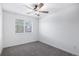 Well-lit bedroom with neutral carpet, ceiling fan and ample natural light at 5068 E Crestone Ave, Castle Rock, CO 80104