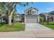 Charming two-story home with a well-maintained lawn, mature tree and attached two car garage at 5068 E Crestone Ave, Castle Rock, CO 80104