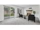 Spacious living room featuring a brick fireplace, sliding glass door to the backyard, and cozy seating at 5068 E Crestone Ave, Castle Rock, CO 80104