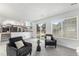 Open-concept living room with a staircase view of kitchen and a sliding glass door at 5068 E Crestone Ave, Castle Rock, CO 80104