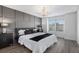 Luxurious main bedroom with a gray accent wall, ample natural light, and stylish decor at 5068 E Crestone Ave, Castle Rock, CO 80104