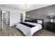 Beautifully designed main bedroom with luxury gray accent wall and walk-in closet at 5068 E Crestone Ave, Castle Rock, CO 80104