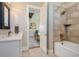 Modern bathroom with a walk-in shower, soaking tub, and a sleek vanity with stone countertop at 2480 Castle Butte Dr, Castle Rock, CO 80109