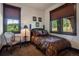 Bedroom with windows overlooking the mountain views, offering a tranquil space at 2480 Castle Butte Dr, Castle Rock, CO 80109