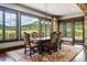 Elegant dining room with hardwood floors, scenic views and stone pillars at 2480 Castle Butte Dr, Castle Rock, CO 80109