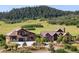 Luxury homes with beautifully landscaped yard overlooking mountains at 2480 Castle Butte Dr, Castle Rock, CO 80109