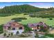 Stunning luxury homes with stone and stucco exterior and professionally landscaped front yard at 2480 Castle Butte Dr, Castle Rock, CO 80109