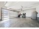 Spacious two car garage with high ceilings and modern glass panel garage door at 2480 Castle Butte Dr, Castle Rock, CO 80109