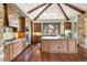Gourmet kitchen with custom cabinets, large island, and stainless steel appliances at 2480 Castle Butte Dr, Castle Rock, CO 80109