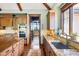 Gourmet kitchen with stainless steel appliances, granite counters, and custom wood cabinetry at 2480 Castle Butte Dr, Castle Rock, CO 80109