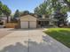 Charming two-story home with a brick facade, and a two-car garage at 2576 S Cody Way, Lakewood, CO 80227