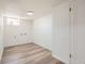 Finished basement featuring plank floors, a utility hookup, and a back door at 3780 Benton St, Wheat Ridge, CO 80212