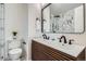 Modern bathroom featuring a double sink vanity and stylish tile work at 3780 Benton St, Wheat Ridge, CO 80212