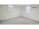 Cozy room with natural light from two windows and air conditioning unit at 3780 Benton St, Wheat Ridge, CO 80212