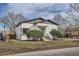 Charming home featuring painted brick, blue front door, and landscaped front yard at 3780 Benton St, Wheat Ridge, CO 80212